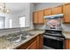 Kitchen with granite countertops and stainless steel appliances at 6099 Camden Forrest Cv, Riverdale, GA 30296