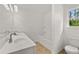 Bathroom with double vanity and bathtub at 1898 Lacebark Elm Way, Lawrenceville, GA 30045