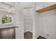 Walk-in pantry with shelving; provides ample storage at 1898 Lacebark Elm Way, Lawrenceville, GA 30045