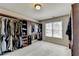 Large walk-in closet with ample shelving and hanging space at 3191 Lake Mcginnis Dr, Suwanee, GA 30024