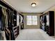 Large walk-in closet with ample shelving and hanging space at 3191 Lake Mcginnis Dr, Suwanee, GA 30024