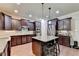 Modern kitchen with an island and stainless steel appliances at 3191 Lake Mcginnis Dr, Suwanee, GA 30024