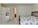 Bedroom with a double bed, private bath access, and hallway view at 3191 Lake Mcginnis Dr, Suwanee, GA 30024