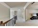Upper hall with access to bedrooms and media room at 3191 Lake Mcginnis Dr, Suwanee, GA 30024