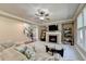 Spacious living room featuring a fireplace and ample natural light at 3191 Lake Mcginnis Dr, Suwanee, GA 30024