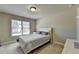 Bright bedroom with window and neutral walls at 3191 Lake Mcginnis Dr, Suwanee, GA 30024