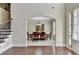 Formal dining room with hardwood floors and a chandelier at 3191 Lake Mcginnis Dr, Suwanee, GA 30024