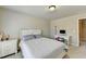 Bedroom with a desk and built in shelving at 3191 Lake Mcginnis Dr, Suwanee, GA 30024