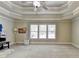Bright bedroom featuring a ceiling fan, large windows, and ample space at 3191 Lake Mcginnis Dr, Suwanee, GA 30024