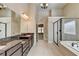 Spa-like bathroom with double vanity, granite countertop, large shower and tub at 3191 Lake Mcginnis Dr, Suwanee, GA 30024