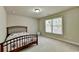 Spacious bedroom with a double bed and large window at 3191 Lake Mcginnis Dr, Suwanee, GA 30024