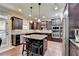 Modern kitchen with granite countertops and stainless steel appliances at 3191 Lake Mcginnis Dr, Suwanee, GA 30024