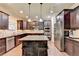 Modern kitchen with granite countertops and stainless steel appliances at 3191 Lake Mcginnis Dr, Suwanee, GA 30024