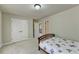 Bedroom with double bed, double doors to closet and hallway access at 3191 Lake Mcginnis Dr, Suwanee, GA 30024
