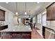 Kitchen with granite countertops and an island open to Gathering room at 3191 Lake Mcginnis Dr, Suwanee, GA 30024