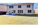 Home's backyard features a patio, grassy lawn, and mature trees at 3191 Lake Mcginnis Dr, Suwanee, GA 30024