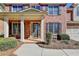 Two-story home's front entrance with columns and landscaping at 3191 Lake Mcginnis Dr, Suwanee, GA 30024