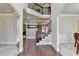 Elegant staircase with wrought iron railings at 3191 Lake Mcginnis Dr, Suwanee, GA 30024