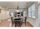 Charming dining area with hardwood floors and chandelier at 3191 Lake Mcginnis Dr, Suwanee, GA 30024