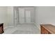 Spacious bedroom with neutral carpeting and ample closet space at 3191 Lake Mcginnis Dr, Suwanee, GA 30024