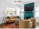 Cozy living room features a fireplace, large TV, and comfortable seating at 1696 Emerald Sw Ave, Atlanta, GA 30310
