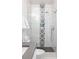 Modern bathroom with patterned tile shower and gray countertop at 1696 Emerald Sw Ave, Atlanta, GA 30310