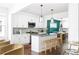 Modern kitchen with white cabinets, a large island, and stainless steel appliances at 1696 Emerald Sw Ave, Atlanta, GA 30310