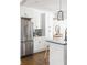 White kitchen with stainless steel appliances and ample cabinet space at 1696 Emerald Sw Ave, Atlanta, GA 30310