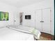 Spacious bedroom with white bedding and artwork at 1696 Emerald Sw Ave, Atlanta, GA 30310