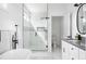 Modern bathroom with a large walk-in shower, soaking tub, and white cabinets at 1696 Emerald Sw Ave, Atlanta, GA 30310