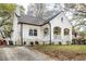 White brick home with a covered porch and landscaping at 1696 Emerald Sw Ave, Atlanta, GA 30310