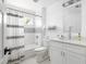 Clean bathroom with white vanity, tub, and shower at 1696 Emerald Sw Ave, Atlanta, GA 30310