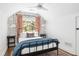 Cozy bedroom with a cloud-print wall and queen bed at 1696 Emerald Sw Ave, Atlanta, GA 30310