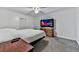 Comfortable bedroom with ceiling fan and a large TV at 198 Oak Hill Cir, Canton, GA 30114