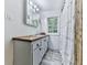Updated bathroom with wood vanity top and patterned shower curtain at 198 Oak Hill Cir, Canton, GA 30114