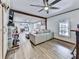 Open concept living area featuring a sectional sofa and a view of the kitchen at 198 Oak Hill Cir, Canton, GA 30114