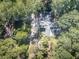 House surrounded by a dense forest with a long driveway leading to it at 198 Oak Hill Cir, Canton, GA 30114
