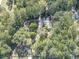 House nestled among trees, accessible by a long, winding driveway at 198 Oak Hill Cir, Canton, GA 30114