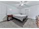 Bright bedroom with ceiling fan, ample space, and neutral carpet at 198 Oak Hill Cir, Canton, GA 30114