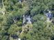 Bird's eye view of a house nestled in a lush green forest at 198 Oak Hill Cir, Canton, GA 30114