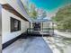 Front view of charming white house with black accents and covered porch at 198 Oak Hill Cir, Canton, GA 30114