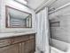 Clean bathroom with wood vanity, granite countertop and a shower/tub combo at 198 Oak Hill Cir, Canton, GA 30114