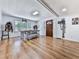 Bright dining room featuring a rustic wooden table and hardwood floors at 198 Oak Hill Cir, Canton, GA 30114