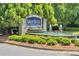 Community entrance with a beautiful fountain and landscaping at 1896 Alcovy Bluff Way, Lawrenceville, GA 30045