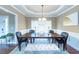 Formal dining room with hardwood floors and a chandelier at 1896 Alcovy Bluff Way, Lawrenceville, GA 30045