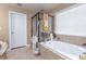 Relaxing bathroom with a soaking tub and a separate shower at 1896 Alcovy Bluff Way, Lawrenceville, GA 30045