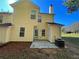 Yellow house with a back patio and yard at 2095 Manhattan Pkwy, Decatur, GA 30035