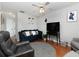 Relaxing living room with hardwood floors, seating and a large TV at 253 Gallant Se # 17, Mableton, GA 30126