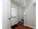 Bright entryway with hardwood floors, white door and staircase at 253 Gallant Se # 17, Mableton, GA 30126