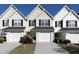 Three-unit townhouse building with attached garages and landscaping at 253 Gallant Se # 17, Mableton, GA 30126